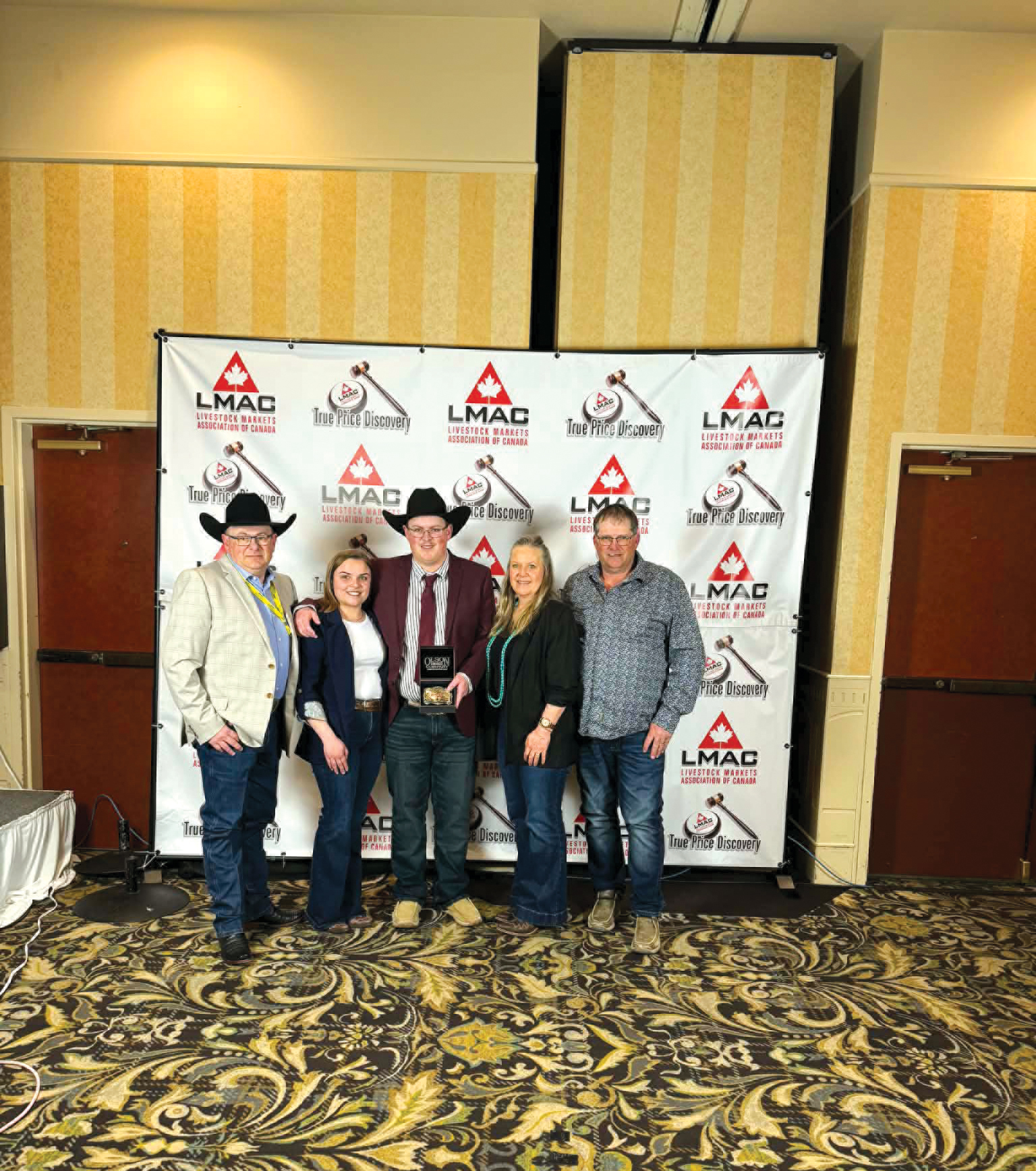 Ty Cutler and his family at the Man/Sask Auctioneer Championship in Maple Creek in May.<br />
